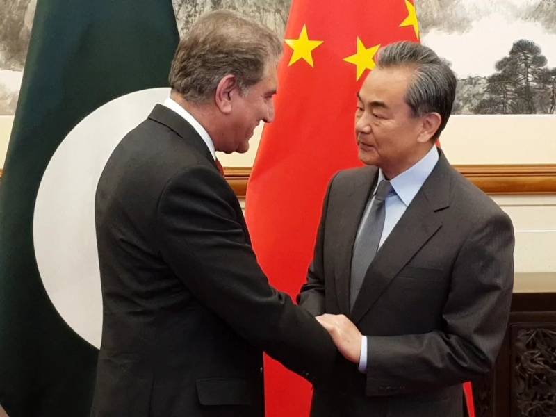 FM Qureshi meets Chinese counterpart in Beijing, discuss bilateral ties 