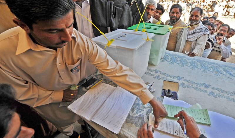 Police arrest armed men outside polling station in Daska