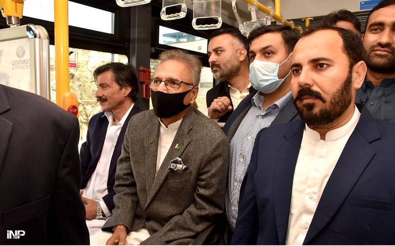 President Alvi rides on Green Line bus, expresses satisfaction over service