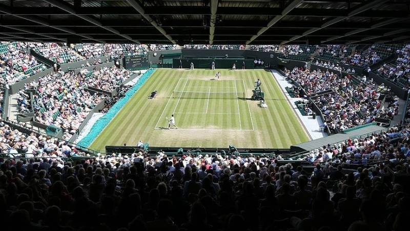 Russian, Belarusian tennis players banned from Wimbledon