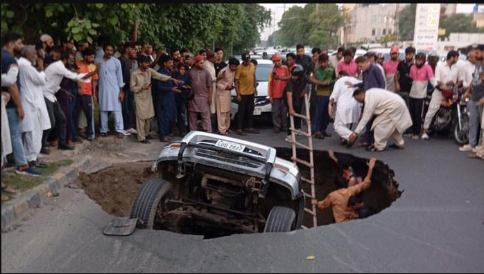 Massive sinkhole swallows three vehicles in Lahore