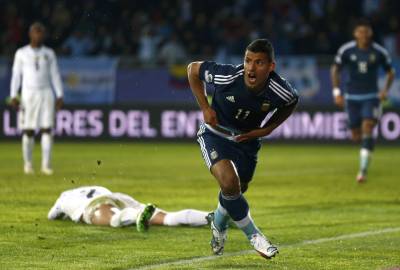 Aguero's diving header downs Uruguay