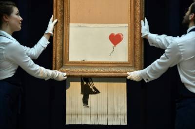 New video shows Banksy's 'Girl with Balloon' should have been totally shredded
