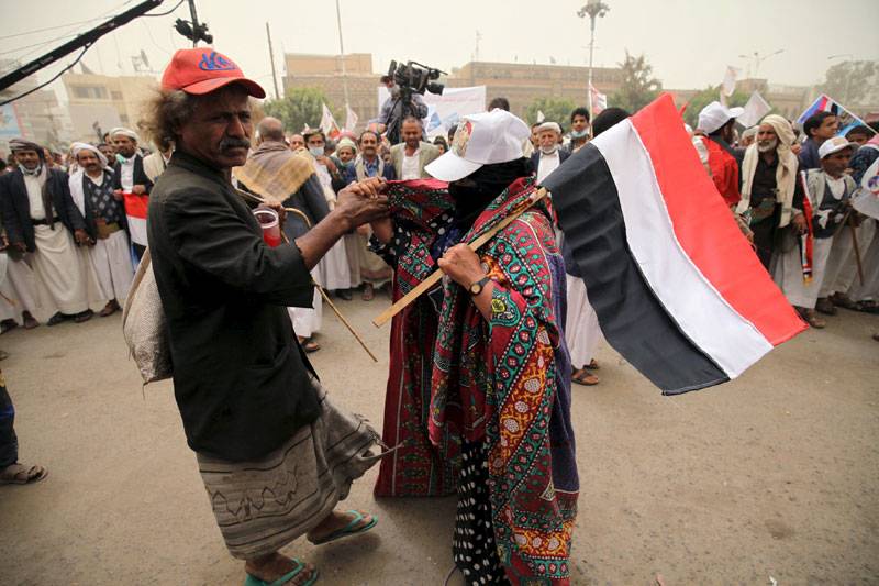 Supporters of Yemen's former President participate during a rally against air strikes in Sanaa