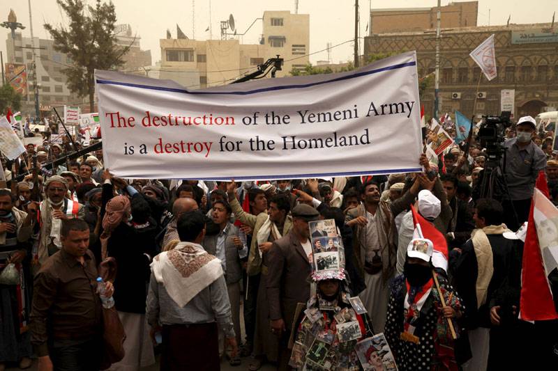 Supporters of Yemen's former President participate during a rally against air strikes in Sanaa