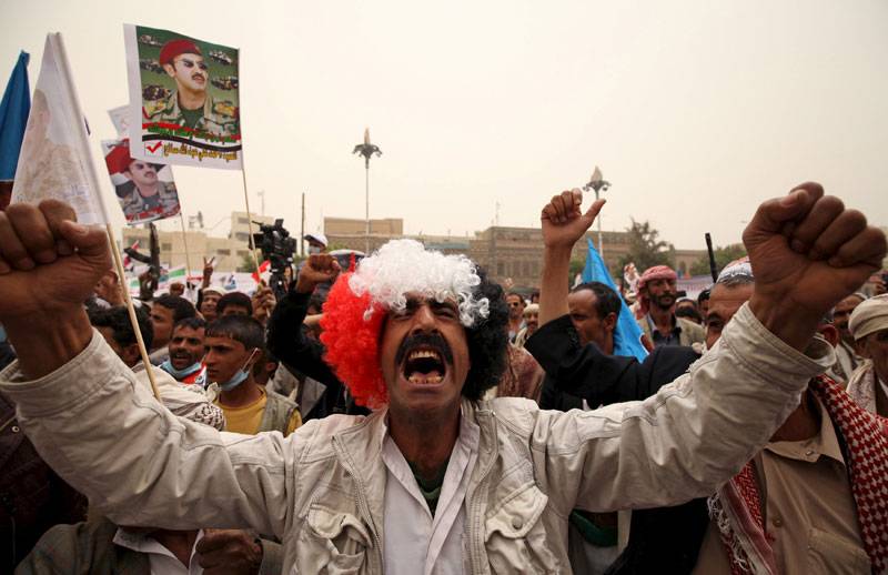 Supporters of Yemen's former President participate during a rally against air strikes in Sanaa