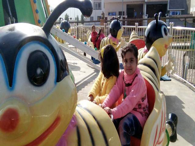  Children are playing newly City land Park in Jhelum