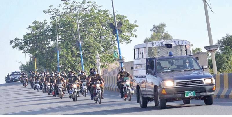 Police hold flag march in Sargodha