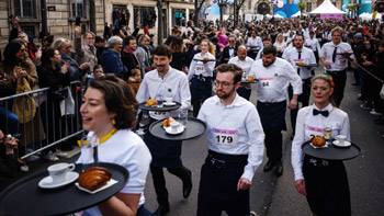 Paris waiters compete in race to get a coffee and croissant