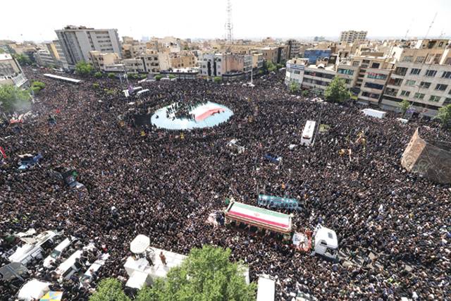 Huge crowds in Iran capital for president’s funeral