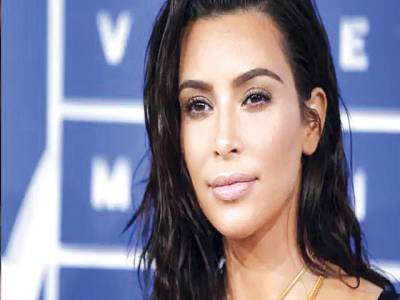 Kardashian has her ‘chin up’ as Kanye West drags social media drama